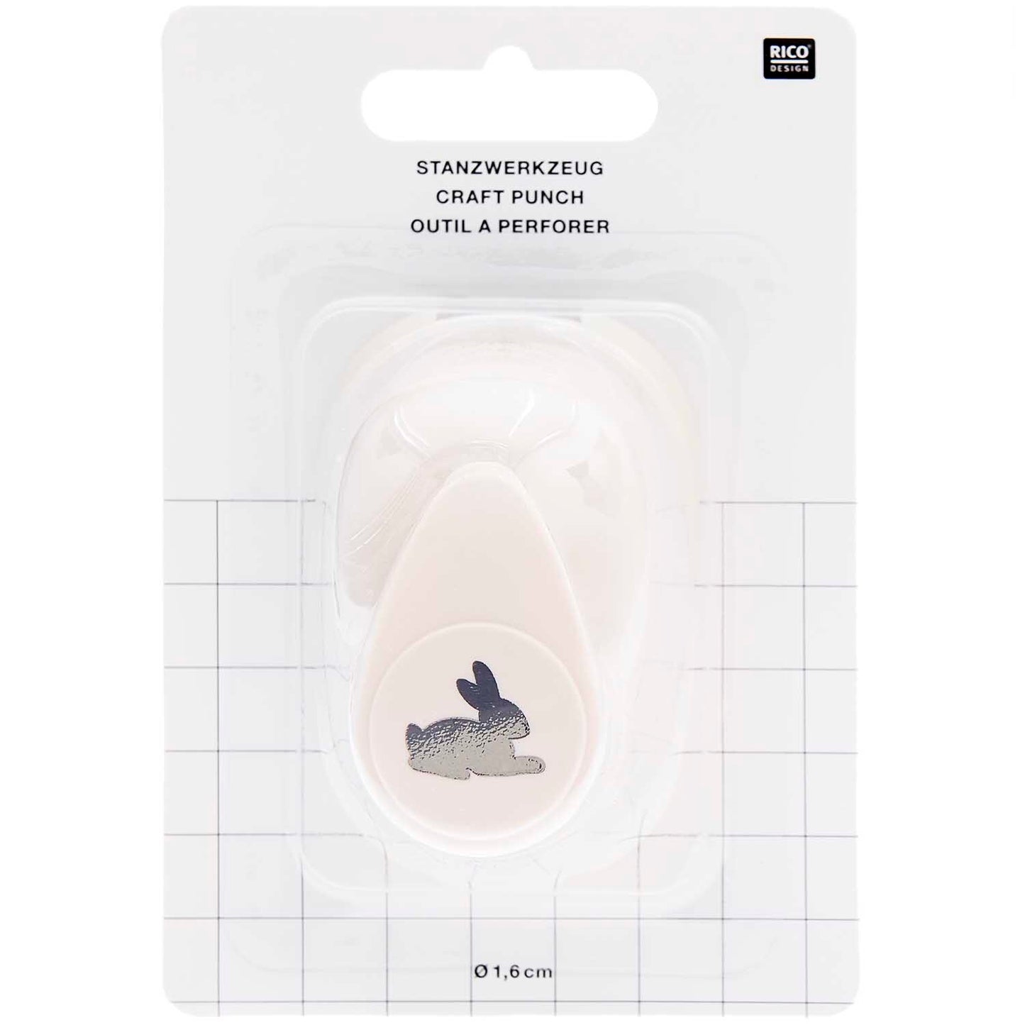 Ausgestanzte Hasen-Motive aus weißem Bastelpapier als DIY-Tischstreu für die Kinderbeschäftigung